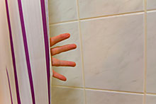 Using Curved Shower Curtain Rods to Increase Shower Space